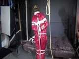 Watch Sandra bound gagged and noosed wearing her shiny nylon Rainwear