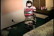 25 Yr OLD 2nd GRADE SCHOOL TEACHER IS MUMMY WRAPPED AND GAGGED WITH PLASTIC WRAP, BLACK ELECTRICAL TAPE AND SILVER DUCT TAPE ON A CHAIR (D68-13)