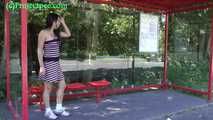 068023 Ling Ignores The Passing Traffic As She Pees At The Bus Stop