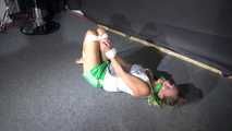 Sexy Sandra being tied and gagged on the floor wearing a sexy green shiny nylon shorts and a white top (Video)