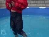 Watch Sandra enjoying the Pool during a hot summer Day with her shiny nylon Downjacket