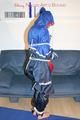 Jill tied, gagged and hooded wearing shiny nylon rainwear (Pics)