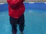 Watch Sandra enjoying the Pool during a hot summer Day with her shiny nylon Downjacket