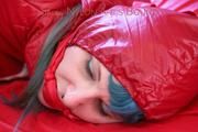 Mara tied, gagged and hooded on bed wearing a shiny red old school down jacket and pants (Pics)