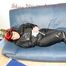 Jill tied and gagged on a blue sofa wearing sexy black downwear (Pics)