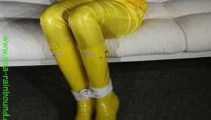 Get Pictures of Pia bound and gagged in her yellow shiny nylon Rainwear