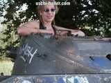 Nathalie poses on a Hotchkiss armored personnel carrier