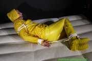 Get Pictures of Pia bound and gagged in her yellow shiny nylon Rainwear