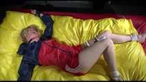 SEXY SONJA being tied and gagged on a bed stimulated with an massager wearing a hot red shiny nylon shorts and an oldschool red/blue rain jacket (Video)