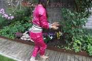 Watching Aiyana wearing supersexy pink shiny nylon rainwear while planting flowers in the garden (Pics)