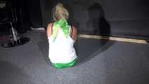 Sexy Sandra being tied and gagged on the floor wearing a sexy green shiny nylon shorts and a white top (Video)