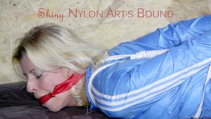 HOT HOT HOT PIA being tied and gagged on a sofa with ropes and a cloth gag wearing a sexy lightblue shiny nylon shorts and a lightblue rain jacket (Pics)