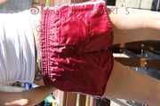 Watching sexy SANDRA wearing a supersexy special red shiny nylon shorts and a white top sweeping the terrace in the SUN enjoying the shiny weather (Pics)