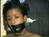 BLACK SHONDA IS WRAP TAPE GAGGED & BOUND UP WITH BLACK ELECTRICAL TAPE (D33-10)