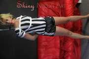 Sexy Pia wearing a sexy black shiny nylon shorts and a top being tied and gagged with ropes and a cloth gag overhead (Pics)