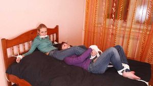 Catt and Alexa - Naughty girl tied up before joining helpless girlfriend on the bed