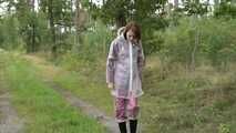 Miss Petra takes a walk in an AGU rain suit, transparent rainsuit and rubber boots (looped version)