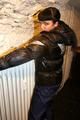 Jill tied and gagged in a black downjacket and rainpants