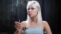 Ash hair color girl is smoking two cigarettes