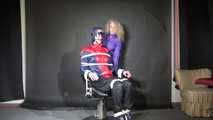 Watzching sexy PIA wearing a sexy oldschool rainwear combination in red/blue sitting on a hairdresser´s chair being tied and gagged from Sophie (Video)