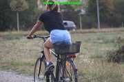 Watch Sandra riding her bike enjoying her shiny nylon shorts