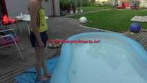 Watching sexy Sonja enjoying the water in the pool and the feeling of shiny nylon on her skin wearing a sexy shiny nylon shorts and a top (Video)