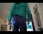 Mara wearing a blue shiny nylon shorts a black leggin and a grren rain jacket during her workout (Video)