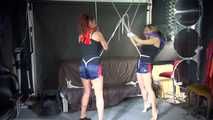 Watching sexy Stella and Sandra both wearing a hot shiny nylon shorts and a top being tied and gagged overhead with ropes and a ballgag (Video)