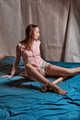 Sexual spreaded legs with jute and wood in pink clothes