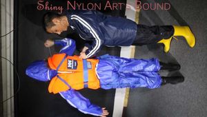 See Ronja tied and gagged by Stella in shiny nylon Rainwear and a Life Vest!