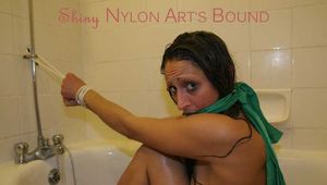 Stella tied and gagged with ropes and a cloth gag in a bath tub wearing ONLY a sexy black shiny nylon shorts (Pics)