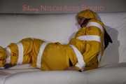 Watching Pia being tied and gagged with tape and a cloth gag wearing sexy yellow shiny nylon rainwear (Pics)