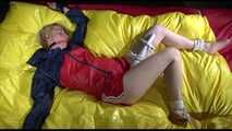 SEXY SONJA being tied and gagged on a bed stimulated with an massager wearing a hot red shiny nylon shorts and an oldschool red/blue rain jacket (Video)