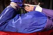 Sonja tied, gagged and hooded with ropes and a cloth gag on the sofa wearing a supersexy blue rain pants and a purple rain jacket (Pics)