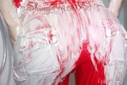 Sonja taking a shower after messy up her shiny nylon jumpsuit with shaving cream (Video)