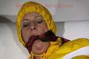 Watching Pia being tied and gagged with tape and a cloth gag wearing sexy yellow shiny nylon rainwear (Pics)