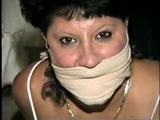 33 YEAR OLD AMERICAN INDIAN TRISH IS MOUTH STUFFED, CLEAVE & OTM ACE BANDAGE GAGGED, BALL-TIED & HOG-TIED WEARING PANTYHOSE (D58-12)