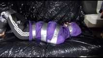 SANDRA tied and gagged with tape on a sofa wearing a sexy black shiny nylon pants and a purple rain jacket (Video)