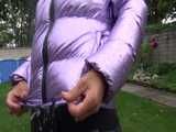 Watch Sandra taking a shower in her new purple shiny nylon down jacket 