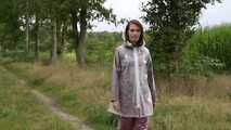 Miss Petra takes a walk in an AGU rain suit, transparent rainsuit and rubber boots (looped version)