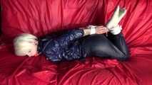 Sexy Courtney being tied and gagged on a sofa wearing sexy shiny nylon rainwear (Video)