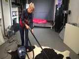 Watch sonja cleaning the room in her shiny nylon Rainwear