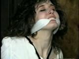 ERICA IS RING GAGGED, MOUTH STUFFED, CLEAVE GAGGED & TIED WITH BLACK NYLON ROPE (D36-10)