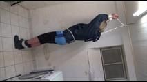 Pia tied and gagged over head in a laundry wearing a supersexy black leggins and a blue shiny nylon adidas shorts as well as a blue rain jacket (Video) 