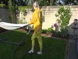 Watch Chloe enjoying the warm Sun in her yellow shiny nylon Rainsuit 