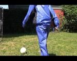 Mara wearing a blue rainwear combination while playing soccer with herself (Video)