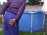 Watch Sandra enjoying Shower in her shiny nylon Downwear in the Garden