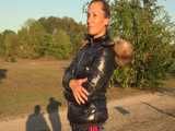 Watch Sandra enjoying her shiny nylon Downjacket at very warm Wearther outside