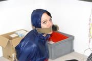 Simone tied and gagged in shiny nylon rainwear