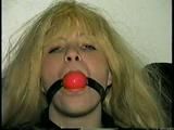 SEXY BOMBSHELL TRACY BALL-GAGS HERSELF, IS MOUTH STUFFED & HANDGAGED (D38-10)